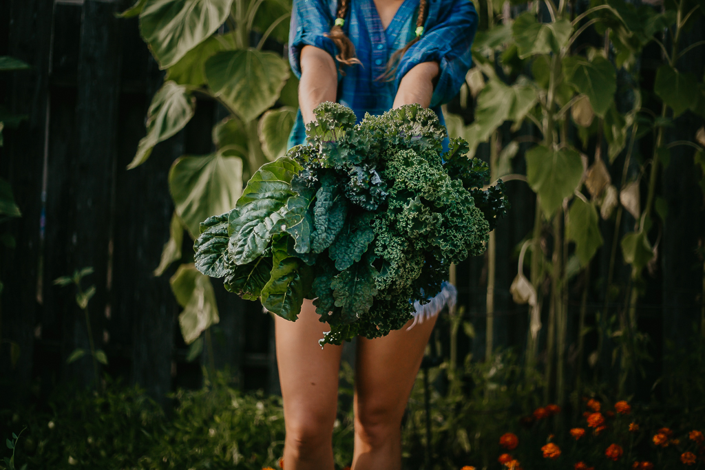 Holding a bouquet of kale